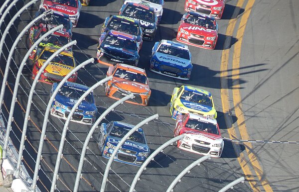 Jimmie Johnson leads a pack of Generation 6 cars three-wide multiple rows back in the 2015 Daytona 500.